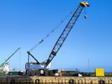 Large blue crane on quay